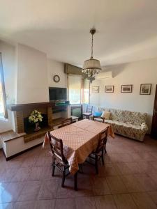 a living room with a table and a couch at Motor Rooms in Maranello