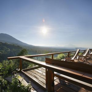 
a view from a balcony overlooking the ocean at Sang Giri - Mountain Glamping Camp in Jatiluwih

