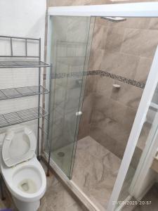 a bathroom with a shower and a toilet at casa confortabla y relajante con alberca y laguna in Monterrey +30 photos