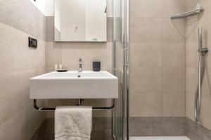 a bathroom with a sink and a shower at Residence Le Vele in Stintino