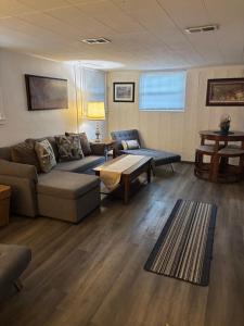 a living room with a couch and a table at Oasis Studio in Cambridge