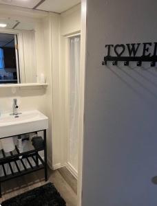 a bathroom with a sink and a mirror at Oasis Studio in Cambridge