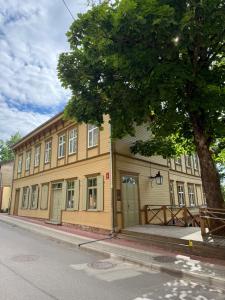 a building on the side of a street at Parka ielas apartamenti in Limbaži