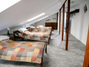 a room with three beds and a staircase at Dom jednorodzinny NOWA in Dęblin