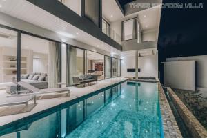 a swimming pool in a house at AAA villa in Ban Bang Po