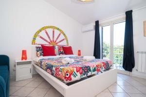 a bedroom with a bed with a ferris wheel at New Naxian Holidays in Giardini Naxos