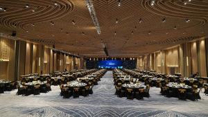 a large banquet hall with tables set up at The Sea Beach Residences - Arena Cam Ranh Resort in Cam Ranh International Airport +24 photos