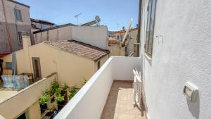 an view of an alley from a balcony of a building at Casa Gala in Mamoiada