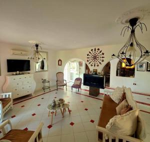 a living room with a couch and a tv at Nanou in Zarzis
