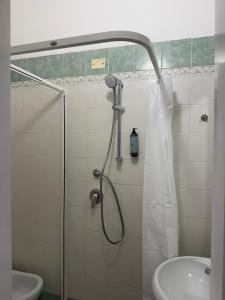 a bathroom with a shower and a sink at Hotel BENGASI Marina Centro in Rimini