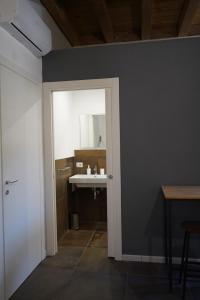 a bathroom with a sink and a mirror at L'antica Dimora Fronte Mare in Finale