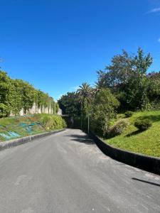 an empty road with a fence on the side at Apartamento La Marquesa in Llanes
