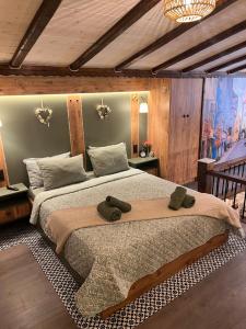 a bedroom with a large bed in a room at Scandinavian Rustic in Tríkala