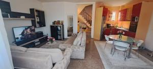 a living room with two couches and a tv at Vila Ambient frontal la mare in Mamaia Sat/Năvodari