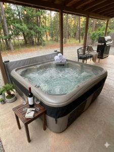 a jacuzzi tub sitting on a patio at Quiet Escape in Ruidoso