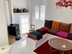 a living room with a couch and a table at Casa Tranquila in Tózar
