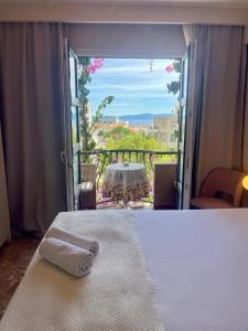 a room with a bed and a view of a table at Villa Bougenvilia Tomas in Tučepi +146 photos