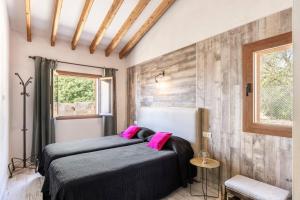 a bedroom with two beds and a window at Villa Maria in Port de Pollensa +26 photos
