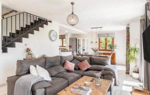 a living room with a couch and a table at Villa Maria in Port de Pollensa