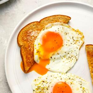 an egg and two pieces of toast on a plate at Jazoj Family hotel in Orikum
