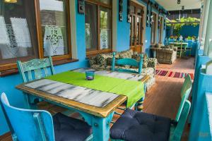 a table in a room with a green table cloth on it at Resedinta Rotundu in Butuceni
