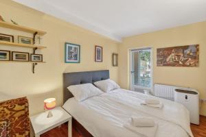 a bedroom with a bed and a window at Izba Vacation Home in Međugorje