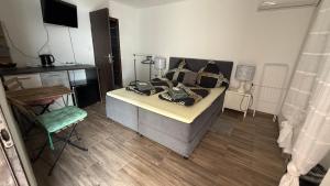 a bedroom with a bed with pillows on it at Apartman Dramalj in Dramalj