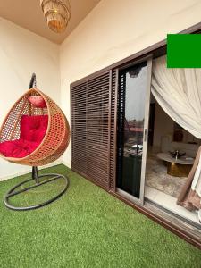 a room with a hammock chair in a living room at 2 bedroom Atrium apartment in Gwarinpa