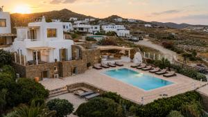 an aerial view of a villa with a swimming pool at Your private Mykonos Villa in Kalafatis