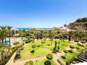 an aerial view of a park with palm trees and the ocean at Heavenly Homes Mojacar 73 in Mojácar