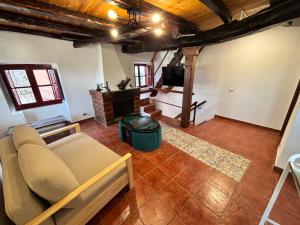 a living room with a couch and a tv at Santa Cruz del sil in Santa Cruz del Sil