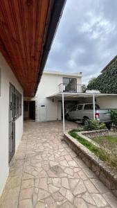 a garage with a car parked in front of a house at Global residencial in Rancagua