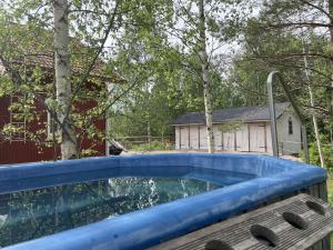 a swimming pool in a yard with a house at Koivuniemen Ranch in Hämeenlinna +26 photos