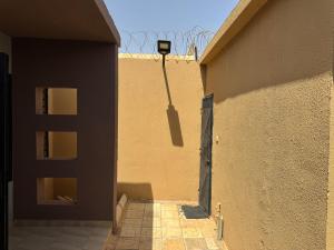 a building with a door on the side of it at Central Residence & Conciergerie Ouaga 2000 in Ouagadougou