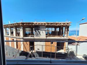 a building under construction with scaffolding on it at Paris Residence Cesme in Çeşme