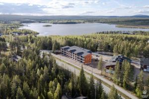 an aerial view of a building next to a lake at Äkäsentie 1 A 211 by Holiday in Lapland in Äkäslompolo