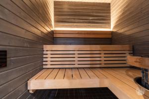 a sauna with a bench in a wooden wall at Äkäsentie 1 A 211 by Holiday in Lapland in Äkäslompolo