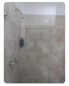 a shower with a glass door in a bathroom at Casa Don Alfonso in Cuernavaca