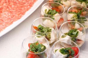 a group of small glasses filled with vegetables on a table at Richmond Hotel Nagoya Shinkansen-guchi in Nagoya