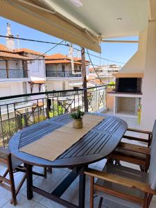 a table and chairs on a balcony with a view at Elizabeth's Home in Flogita +8 photos