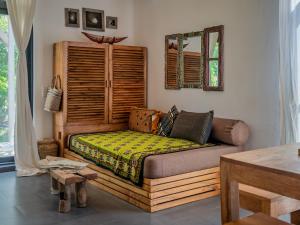a living room with a couch and a window at Zanzibar Stays Accommodation Collection, The Soul, Paje in Paje