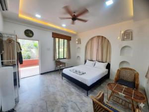 a bedroom with a bed and a table and a couch at CP Villa Resort in Bhāweghar