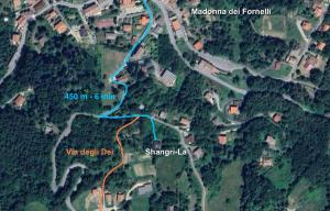 a map of a road with a blue trail at Shangri-La Travellers' Hostel in Castel dellʼAlpi