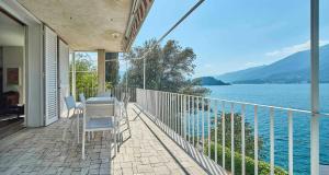 a balcony of a house with a view of the water at Villa Lucy - Lake view in Varenna