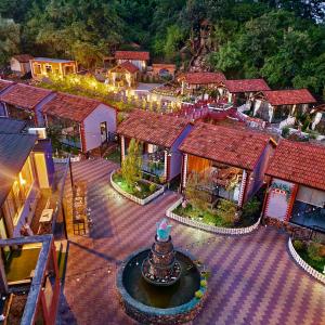 an overhead view of a village with a fountain in a courtyard at TALA ROOMS Hotel in Zaqatala