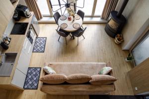an overhead view of a living room with a couch and a table at Szyszkowa Stodoła in Milejczyce