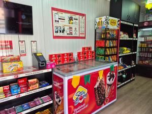 a store with a candy counter in a store at Em condominio in Parnamirim