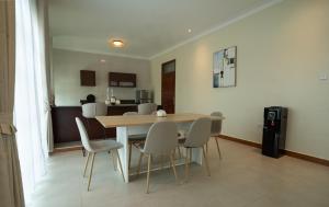 a dining room with a table and chairs at Bella Vista Villas Ltd in Mbarara