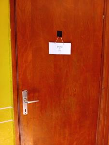 a sign on a door with a sign on it at Studio pr Vok in Lesce +3 photos