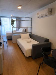 a room with a couch and a bed in it at Baliñas Boutique in Montevideo